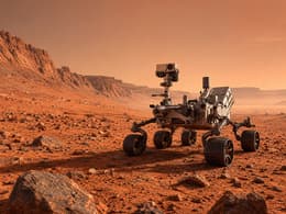 Mars rover crossing rocky red terrain